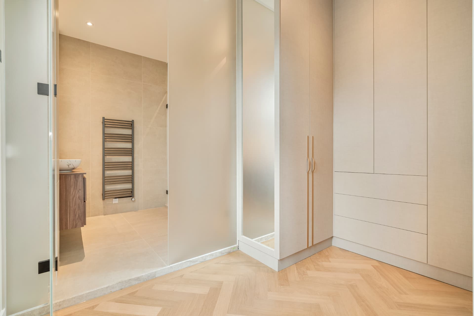 Dressing room with view into the en suite bathroom